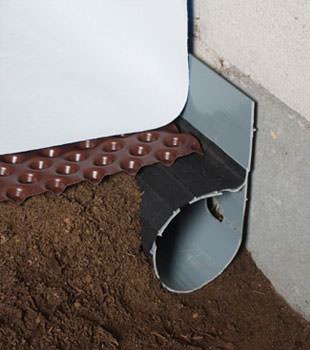 Closeup of a crawl space drainage system installed in Timmonsville