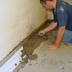 Testing a French drain system in a Camden home.