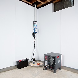 Sump pump system, dehumidifier, and basement wall panels installed during a sump pump installation in Marion