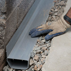 installing a drain tile system in a Bishopville home